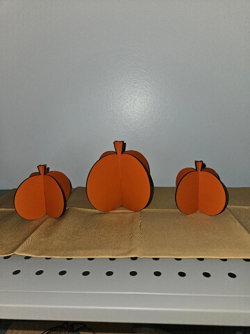 3 pumpkins hand painted and cut